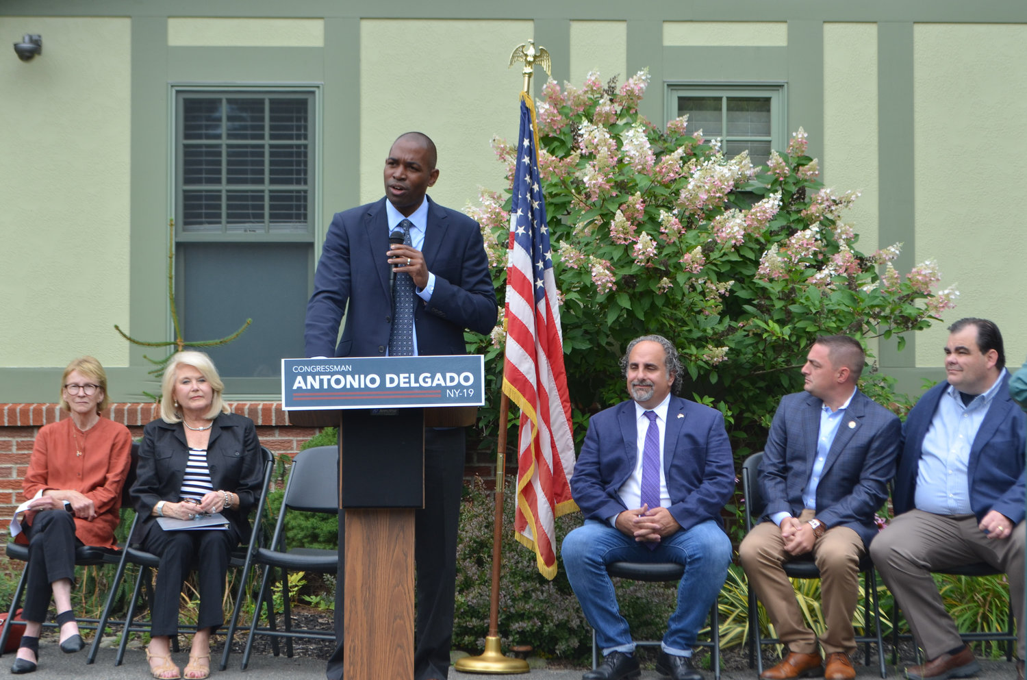 Congressman Antonio Delgado (NY-19) speaks to the importance of local leadership in ensuring funding for the O&W Trail, in front of NY State Assemblywoman Aileen Gunther, back left, Gerry Foundation Chairwoman Sandra Gerry, Town of Fallsburg Supervisor Steven Vegilante, NY State Senator Mike Martucci and Sullivan County legislative chair Rob Doherty.